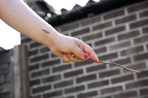 Lightning bolt tattoo on the hip