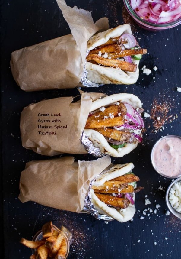 Greek Style Roasted Lamb Gyros with Harissa Spiced Tzatziki