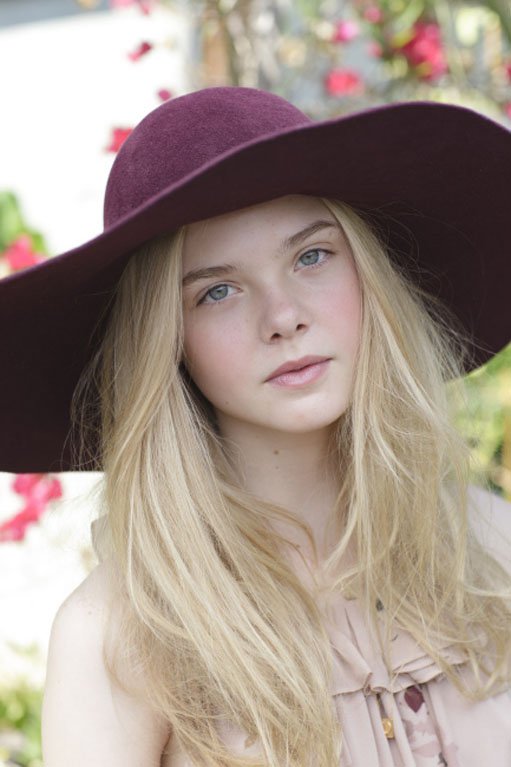 Elle Fanning's Pale Beauty Offset by Plum Fedora