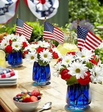 Blue Jars Filled with White and Red Flowers