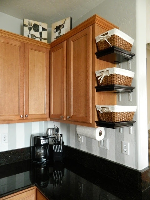 Small Shelves with Baskets Attached to Cabinets