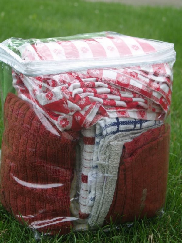 Buy the Dollar Store Bedding Bags to Keep Towels, Etc Together, and Keep Camp Dust off
