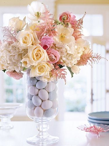 Artificial Eggs Surround a Water Filled Glass