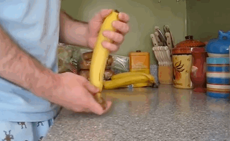 Peel a Banana by Squeezing the Bottom and Pulling It Apart when It Cracks