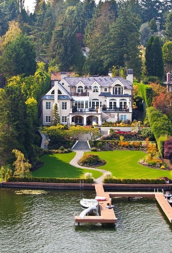 House on Water's Edge with Boat Dock