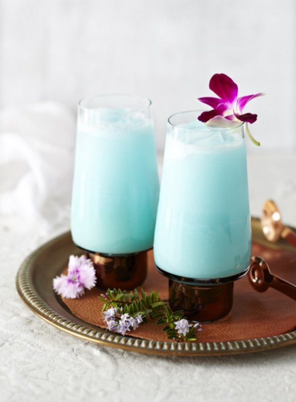 Tropical Cocktail Made of Rum, Pineapple Juice, Curacao, Coconut and Vodka