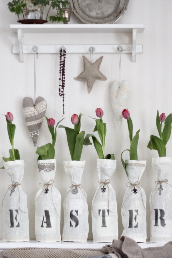 Wine Bottles with White Linen and Letters Printed on the Fronts