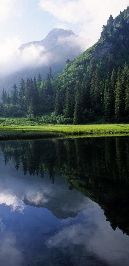 highland,reflection,mountainous landforms,nature,atmospheric phenomenon,