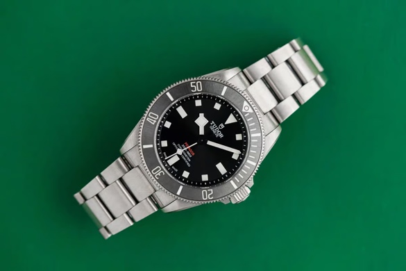 An image containing watch, analog watch, fashion accessory, strap.Automatically generated description