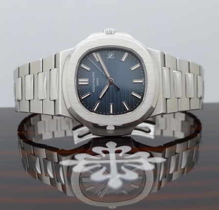 An image containing watch, analog watch, quartz watch.Automatically generated description