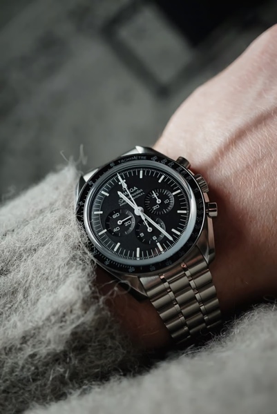 An image containing watch, analog watch, fashion accessory, strap.Automatically generated description